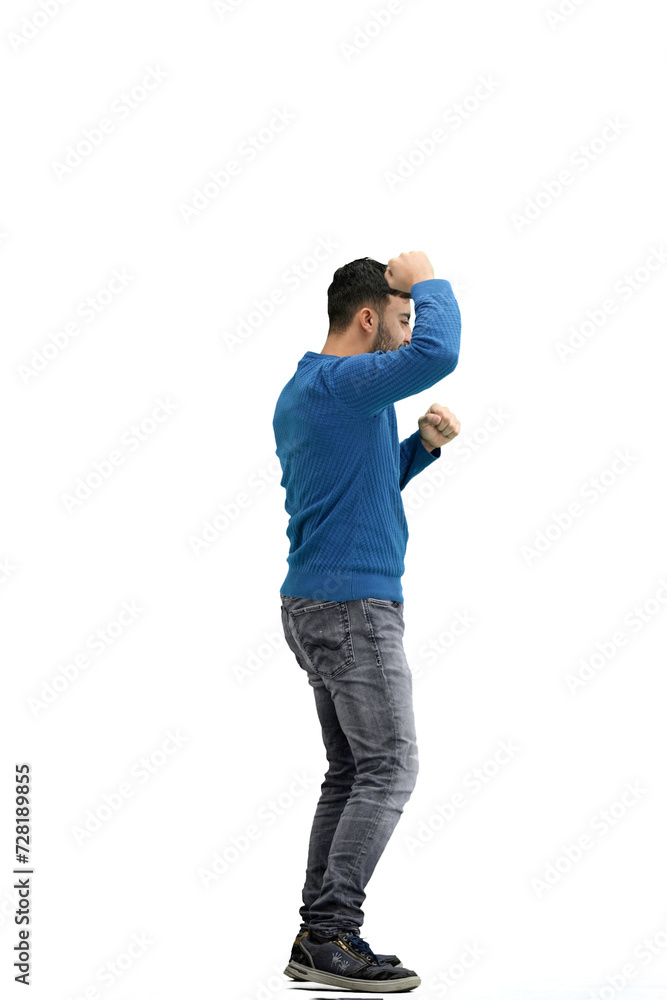 A man, full-length, on a white background, spreads his arms A man, full-length, on a white background, spreads his arms