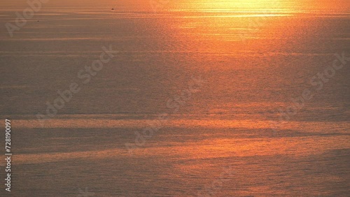 water surface of sea view with golden sunset in the evening, natural background