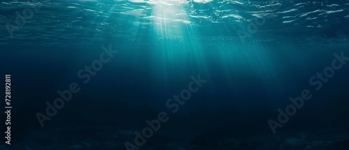 underwater front view of blue water ocean with natural sun light