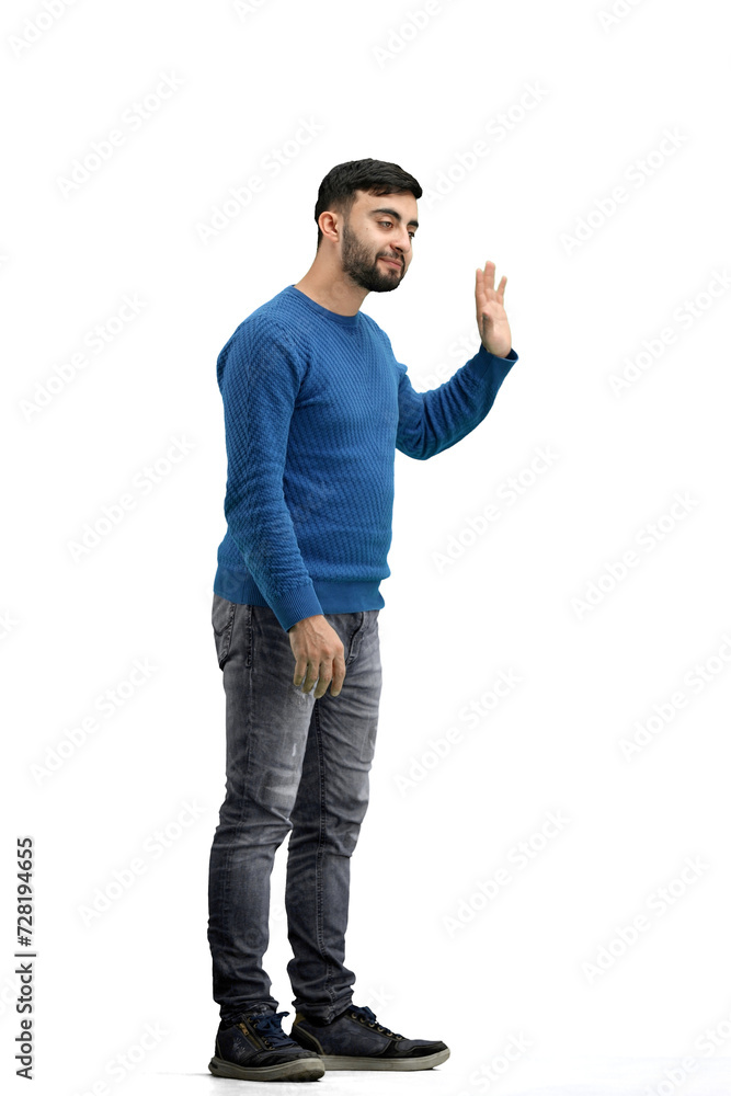 Naklejka premium A man, full-length, on a white background, waving his hand
