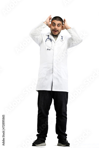 The doctor, in full height, on a white background, is shocked © Katsiaryna