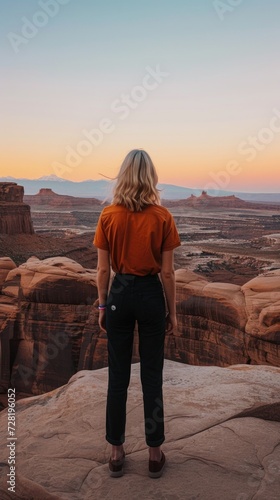 Blonde Woman Solitude in the Canyon: Woman's Contemplative Stance at Golden Hour