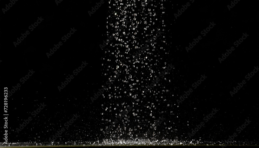 Obraz premium Falling drops, rain, bouncing, water, black background
