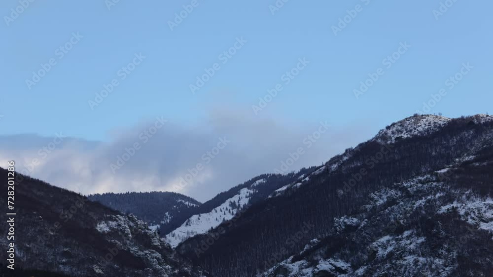 Morning Timelapse of snowy covered hills in the Balkan mountains above the small town of Sopot in Bulgaria Morning Timelapse of snowy covered hills in the Balkan mountains above the small town of Sopot in Bulgaria