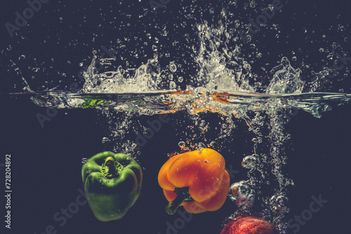 The bell pepper fell into the water and splashed
