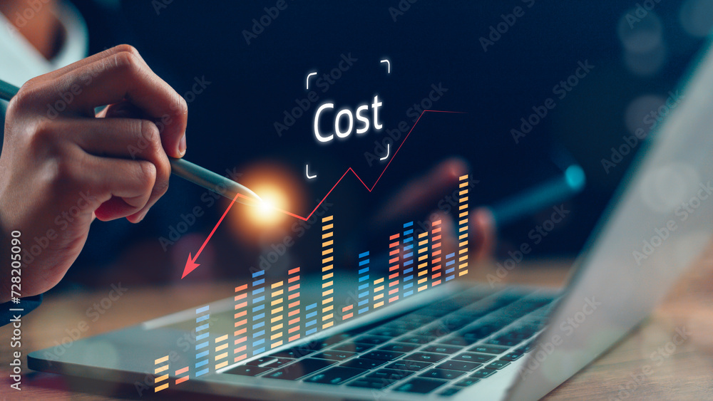Cost reduction concept. Businesswoman pointing down arrow of the graph with cost reduction business finance on virtual screen. Business, technology, cost management, cut budget.