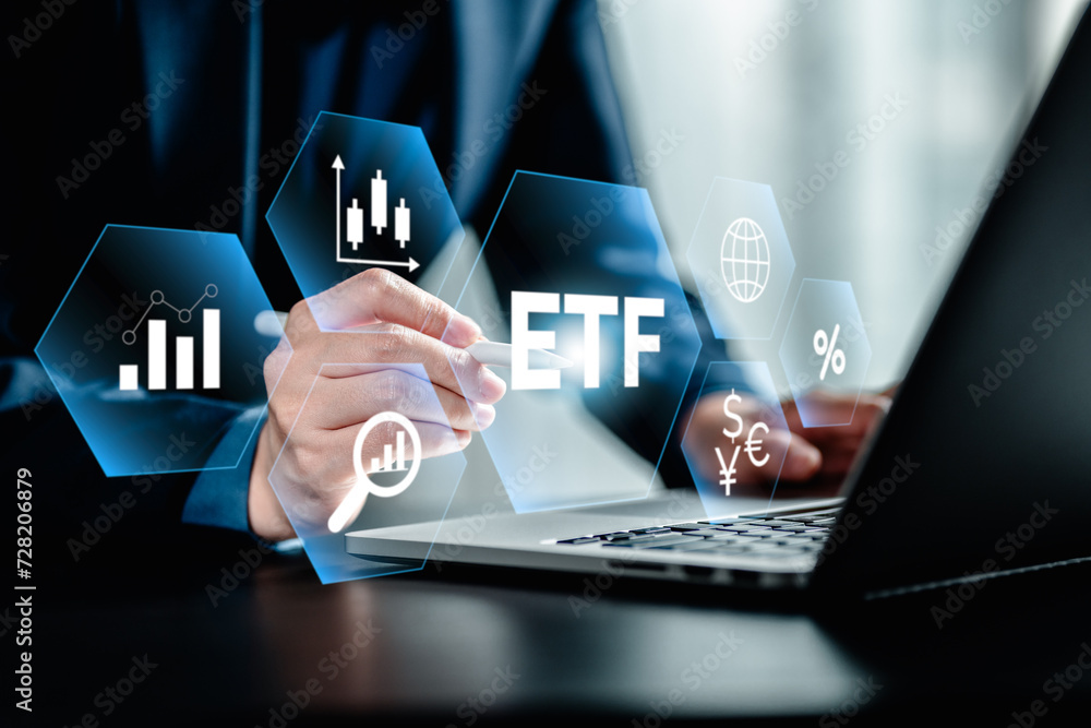 ETF Exchange traded fund stock market trading investment financial concept, Businessman using a laptop analyze index fund with icons of ETF virtual screen ETF Exchange traded fund stock market trading investment financial concept, Businessman using a laptop analyze index fund with icons of ETF virtual screen