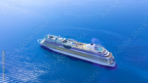 Aerial view of a luxury cruise ship leaving the port. and sailing on an ocean cruise go to the island .Concept of traveling on a cruise ship. © Photo Sesaon