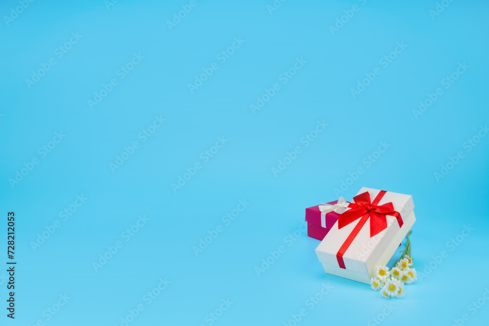 Happy birthday setup concept. Top view, Gift boxes in many colors Many boxes for birthday parties and celebrations, everyone is happy, and more on light blue background with space for text. Happy birthday setup concept. Top view, Gift boxes in many colors Many boxes for birthday parties and celebrations, everyone is happy, and more on light blue background with space for text.