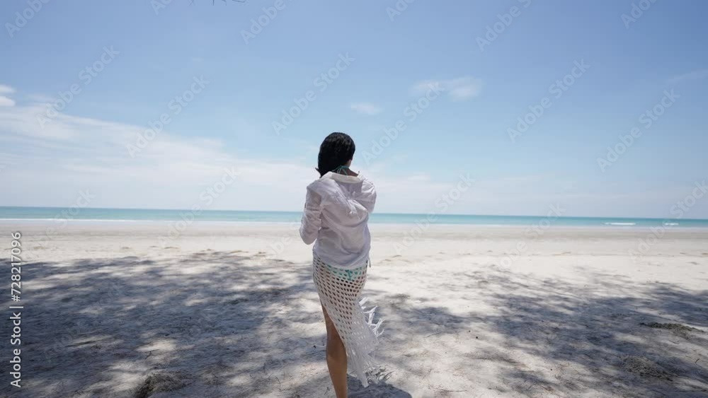 4K Happy woman travel nature ocean on summer beach holiday vacation. Attractive girl in casual clothing relax and enjoy outdoor lifestyle walking and relaxing on tropical island beach in sunny day. 4K Happy woman travel nature ocean on summer beach holiday vacation. Attractive girl in casual clothing relax and enjoy outdoor lifestyle walking and relaxing on tropical island beach in sunny day.
