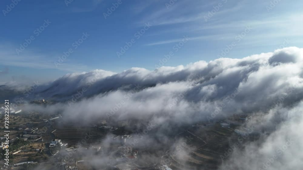 Stunning landscape of clouds over houses in Abha city on sunny day. Aerial, static , Aseer region Vision203 Stunning landscape of clouds over houses in Abha city on sunny day. Aerial, static , Aseer region Vision203