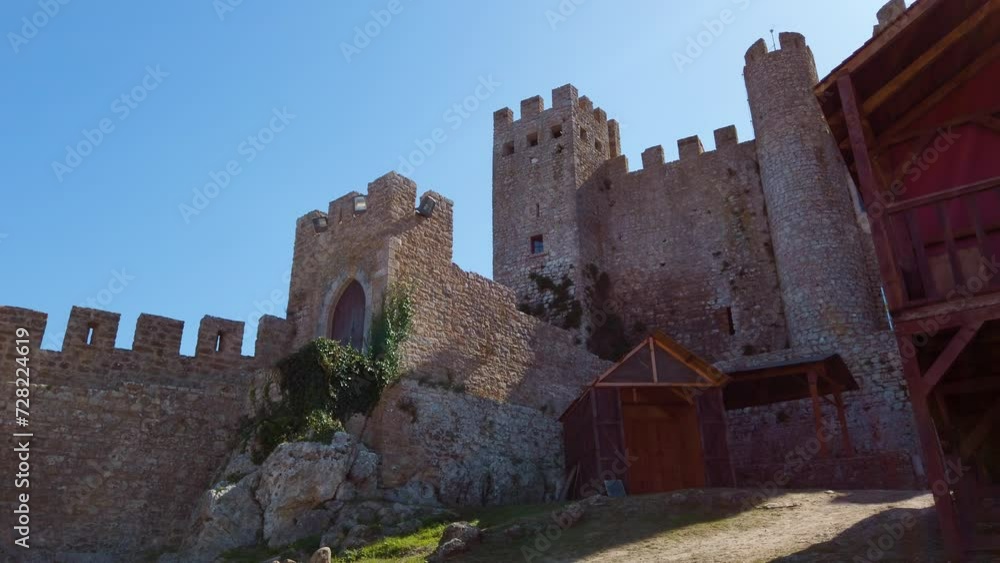 Medieval strong castle tower and side building with fortified walls from Óbidos, Portugal. Medieval strong castle tower and side building with fortified walls from Óbidos, Portugal.