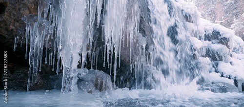 Majestic Melting Icicles Cascade Down the Solid Rock Wall, Creating a Dazzling Melting Icicles Display