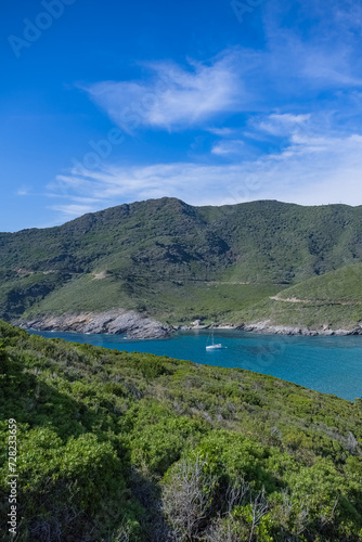 Corsica, seascape in the cap Corse, a beautiful creek with a boat, transparent water, in summer 