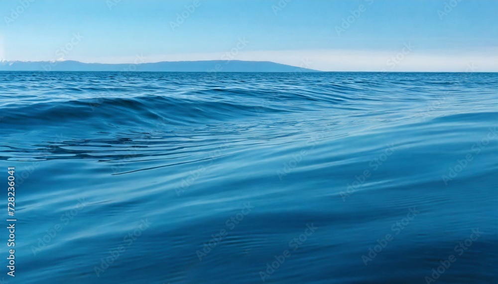 Calm waves of the sea under a blue sky. Calm waves of the sea under a blue sky.
