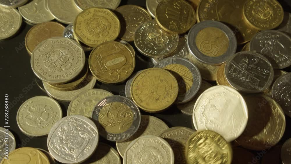 Close up view: Coins of different nations and denominations on table Close up view: Coins of different nations and denominations on table
