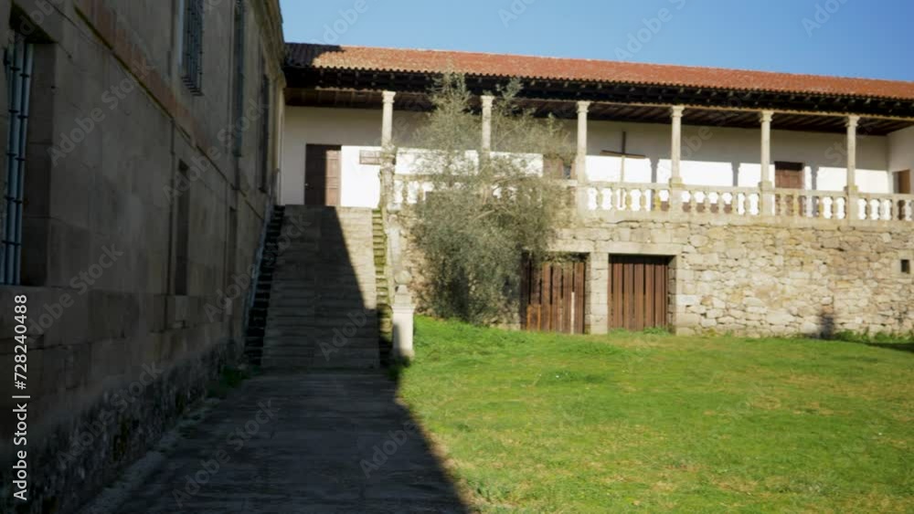 Pan across back entrance and stairs of female monastery Pan across back entrance and stairs of female monastery