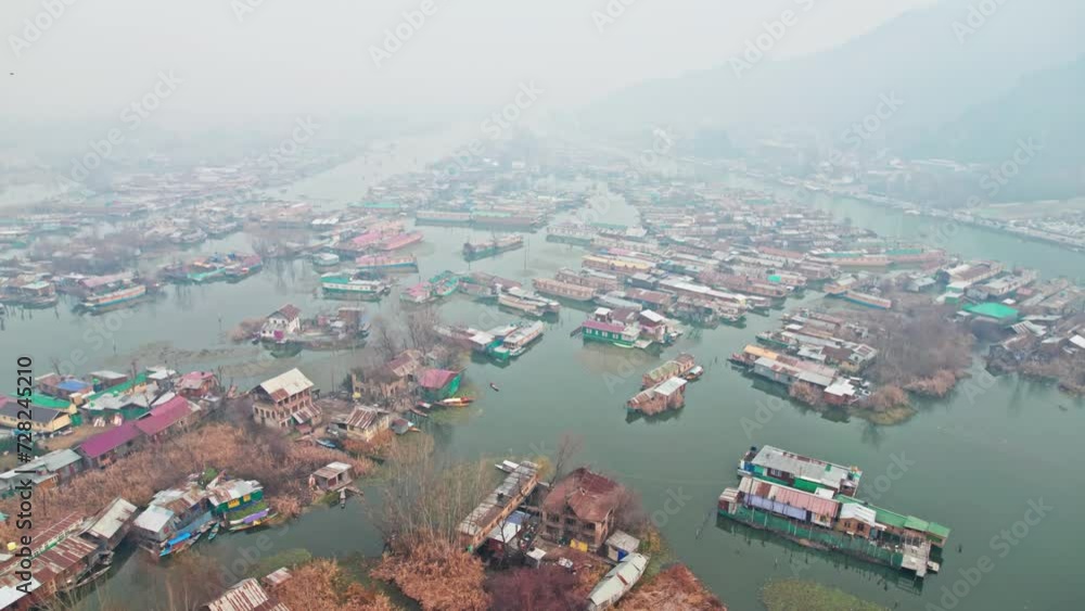 early morning aerial view of house boats in dal lake with fog 4k drone shot at srinagar, kashmir, india early morning aerial view of house boats in dal lake with fog 4k drone shot at srinagar, kashmir, india