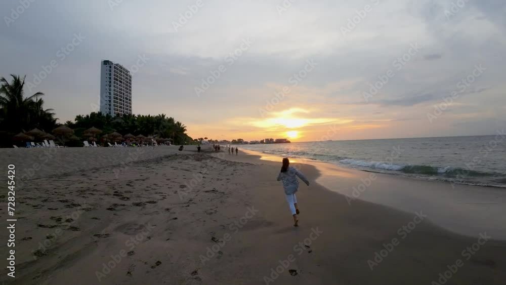Woman Running On The Beach, Punta Centinela Beach In Ecuador At Sunset - Drone FPV Woman Running On The Beach, Punta Centinela Beach In Ecuador At Sunset - Drone FPV