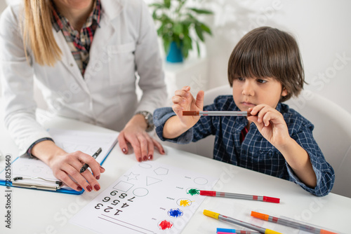 Early cognitive development as toddler engage in a psychology test through coloring various shapes, a playful approach to understanding young minds