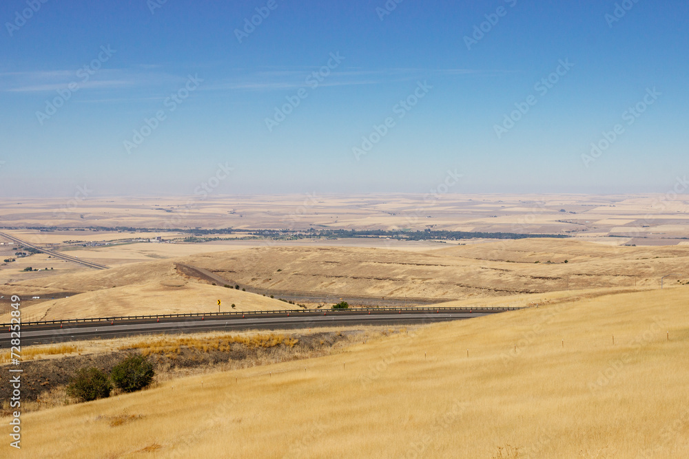 Beautiful summer landscape with a bird's eye view of the hills and mountains in Oregon, USA, on a sunny day. Beautiful summer landscape with a bird's eye view of the hills and mountains in Oregon, USA, on a sunny day.