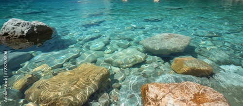 Crystal Clear Waters Surrounding a Serene Rocky Beach: Clean, Se, Water, Rocky, Beach, Clean, Se, Water, Rocky, Beach, Clean, Se, Water, Rocky, Beach