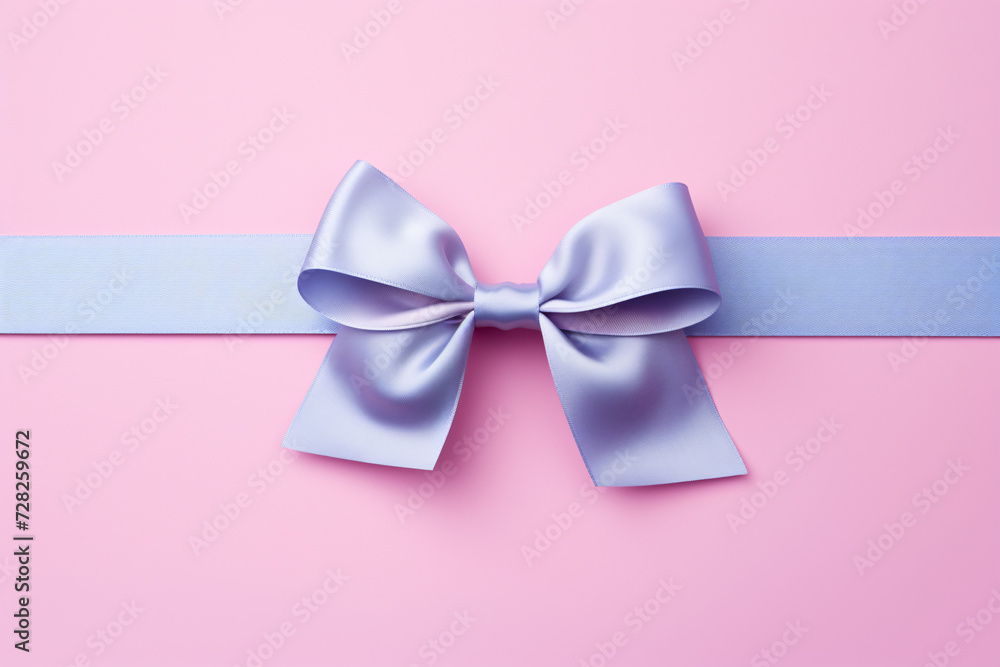 Pastel blue tied gift wrapping ribbon on pink background Pastel blue tied gift wrapping ribbon on pink background