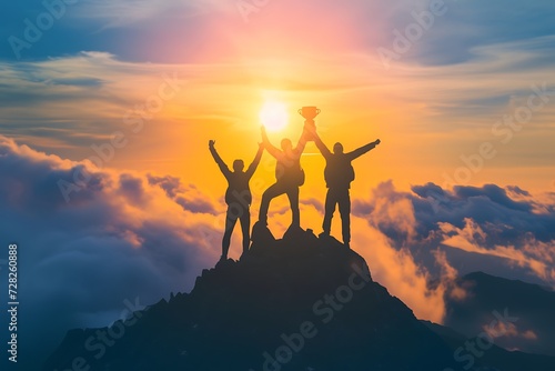 Triumphant Silhouettes Celebrating at Sunset on Mountain Peak Above Clouds - Inspirational Landscape