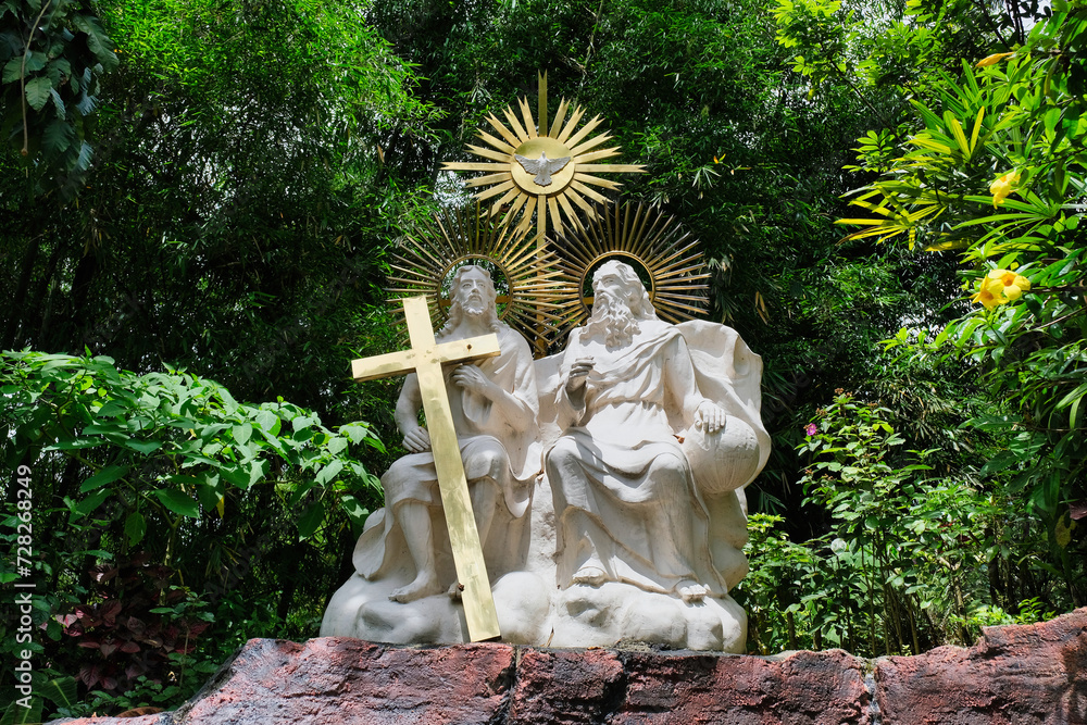 Beautiful sculpture of Jesus with a cross in front of Wonosobo Church ...