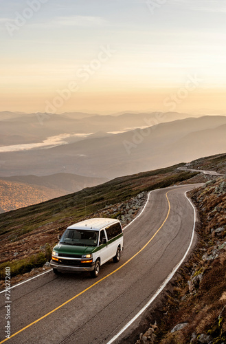 Car climbs mountain road with epic sweeping view, New Hampshire © Cavan