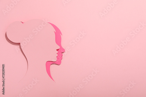 Paper female head on a light background © Atlas
