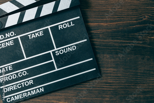 Cuadro en lienzo Vintage photo of movie clapper on wooden background, closeup, top view, copy spa