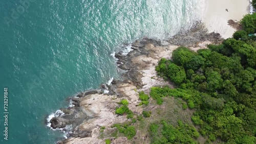 Aerial view of ocean waves hitting the rocky and mountainous coast.Aerial view of ocean waves hitting the rocky and mountainous coast.