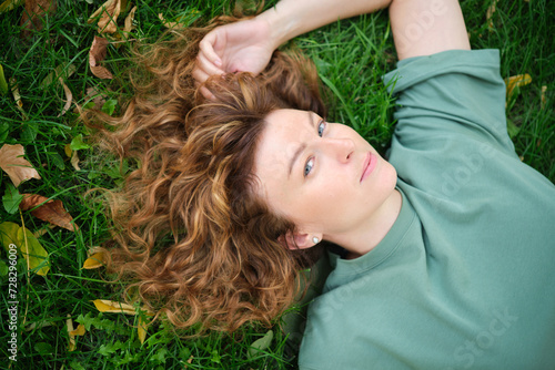 Portrait of happy mature woman looking at camera. Successful proud woman in city street at sunset. Satisfied Caucasian woman in formal clothing smiling outdoors. High quality photo