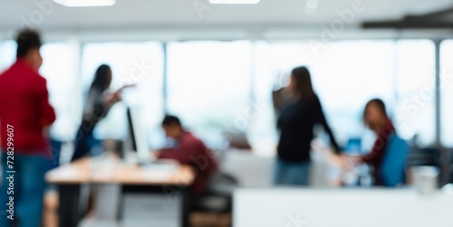 group of people working in a office, blurred view of a busy office