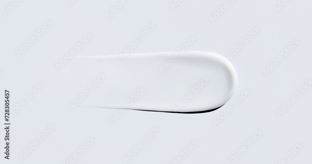cosmetic smear of creamy texture on gray background cosmetic smear of creamy texture on gray background