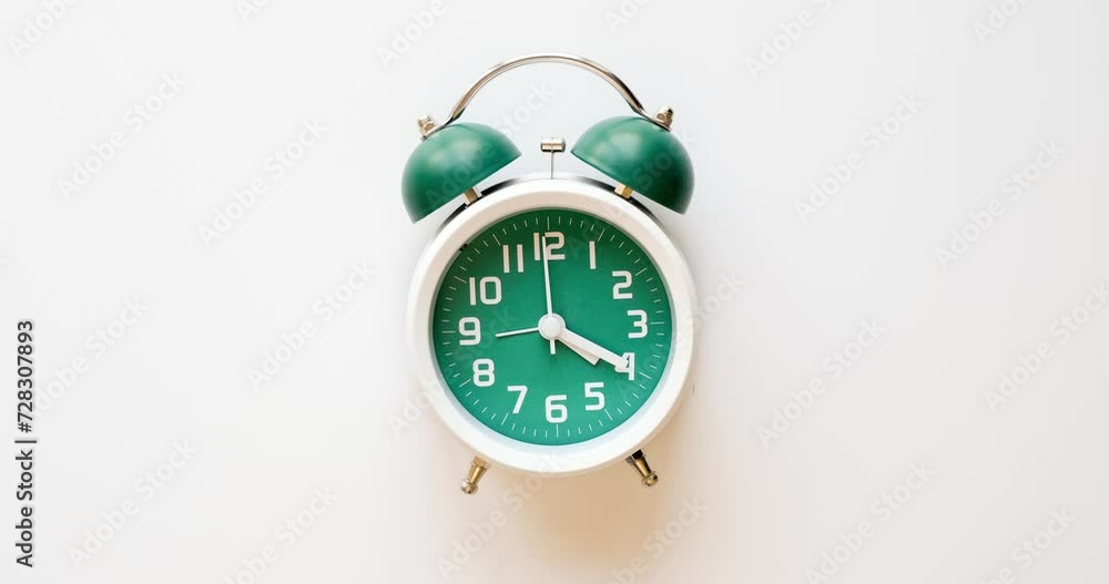 A classic alarm clock counts down time - the hands make a full circle at the 12 o'clock position. Stop motion animation 4K