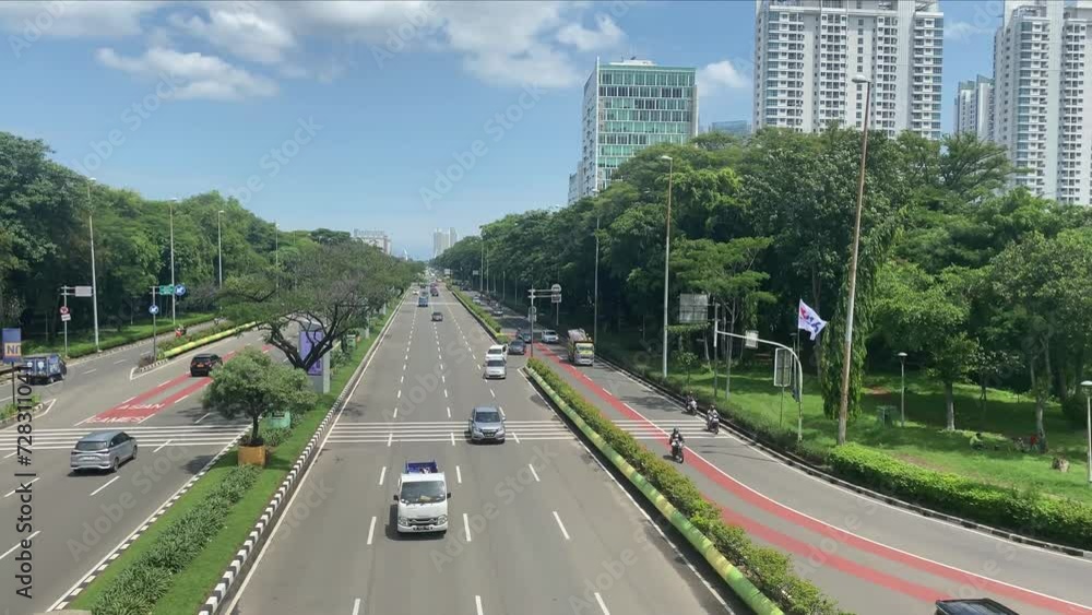 city highway with shady trees beside it city highway with shady trees beside it