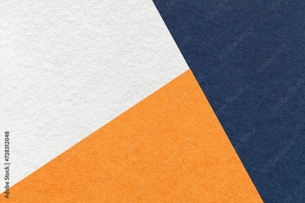 Texture of craft navy blue, white and orange shade color paper background, macro. Vintage abstract cardboard Texture of craft navy blue, white and orange shade color paper background, macro. Vintage abstract cardboard