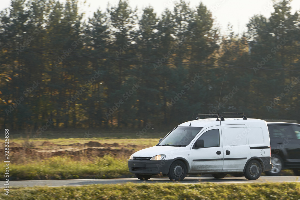 Design your own delivery service with this mockup of a white van. A blank wrap for you to customize with your business logo and name. A commercial vehicle isolated on the road with different views. Design your own delivery service with this mockup of a white van. A blank wrap for you to customize with your business logo and name. A commercial vehicle isolated on the road with different views.