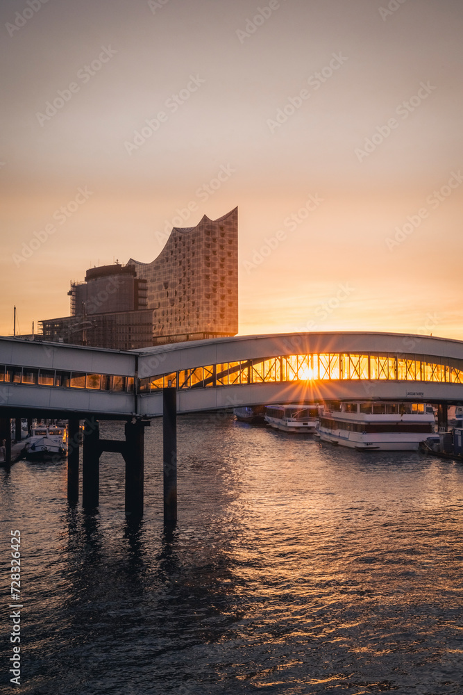 Germany, Hamburg, St. Pauli pier at moody sunrise with Elbphilharmonie in background Germany, Hamburg, St. Pauli pier at moody sunrise with Elbphilharmonie in background