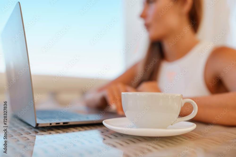 Woman coffee cafe laptop sea. Modern businessman in white uniform working on laptop in coffee shop. Woman sitting at a coffee shop with mobile phone drinking coffee. Woman coffee cafe laptop sea. Modern businessman in white uniform working on laptop in coffee shop. Woman sitting at a coffee shop with mobile phone drinking coffee.
