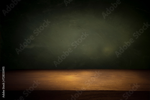 Wooden table with dark blurred background. High quality photo
