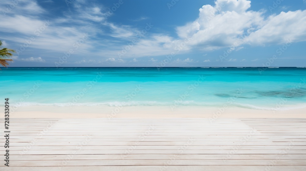 An empty stage on a remote island beach, with white sand and turquoise waters.