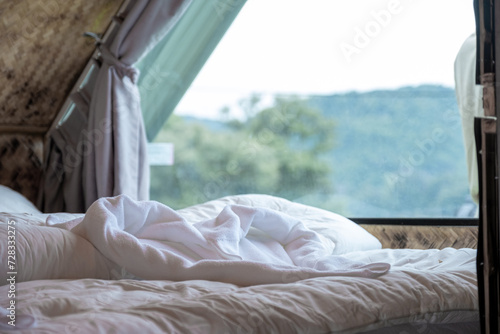 Towels heart shape on the bed in the luxury hotel or resort room ready for tourist travel