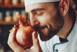 Photo of attractive male cook with love to food onion
