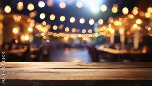 background image of wooden table in front of abstract blurred restaurant lights