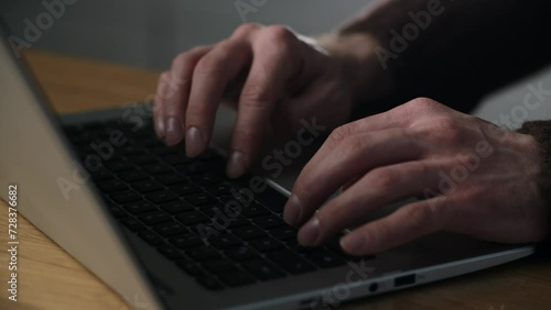 Close up human hands are typing notebook keyboard. Creative copywriter texting to his employer using laptop. Data analytic rewriting formula in application. Click the buttons in notebook photo