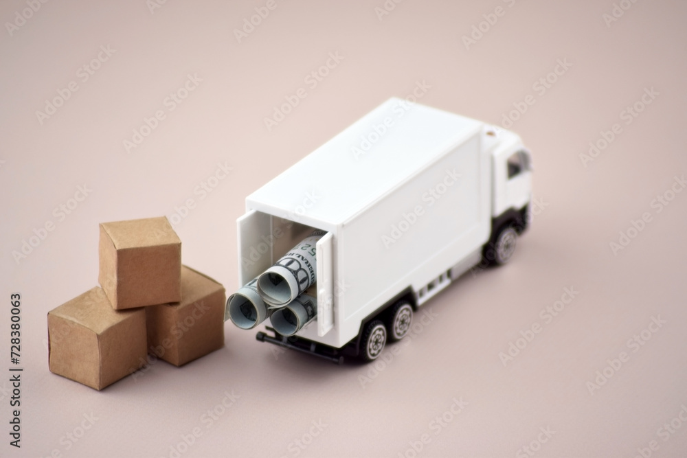 White toy truck with boxes on a light background, space for text. White toy truck with boxes on a light background, space for text.
