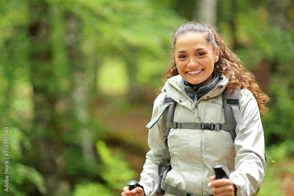 Happy hiker trekking looking at you Happy hiker trekking looking at you